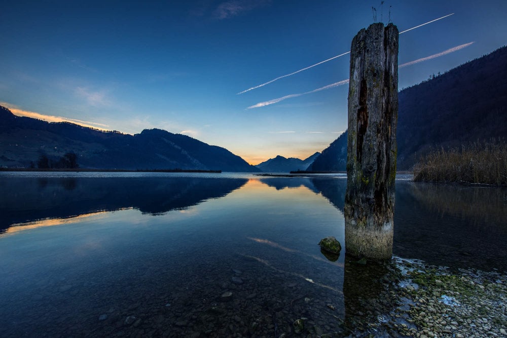 Sunset over lake with mountains